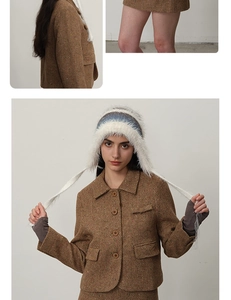 Detail of brown herringbone wool jacket and skirt set with fluffy blue trapper hat