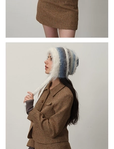 Close-up of vintage brown herringbone woolen suit with a blue striped plush trapper hat