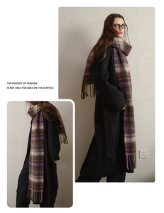 Detail of plaid mohair scarf with tassels in purple, green and beige check pattern