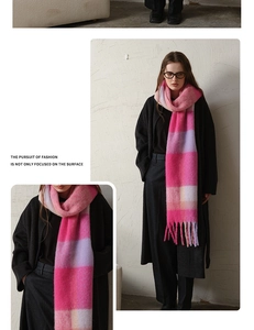 Detail of pink and purple plaid scarf showing thick cashmere texture and fringe tassels