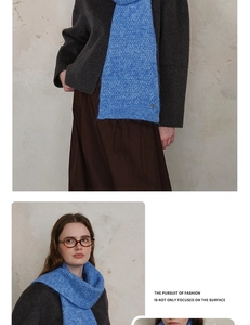 Detail of blue knitted scarf with diamond lattice texture and soft wool blend material