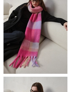 Macro shot of thick lavender and pink plaid scarf texture with long fringe tassels