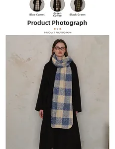 Detailed texture of thick plaid scarf featuring soft fleece lining and premium fringe edges