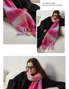 Detail view of thick pink plaid cashmere-like scarf with long tassels and soft texture