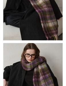 Close-up of thick checkered mohair scarf with tassels in purple and green tones