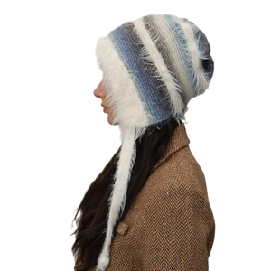 Blue and white gradient knit trapper hat with faux fur trim and cozy earflaps for winter
