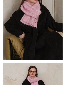 Detail of pink knitted scarf showing fluffy mohair texture and soft knit craftsmanship
