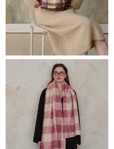 Detailed texture of pink plaid wool scarf paired with a warm beige knit dress outfit