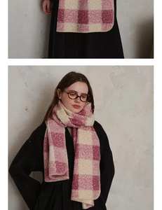 Detailed close-up of pink and white plaid knitted scarf featuring premium lock-edge craftsmanship