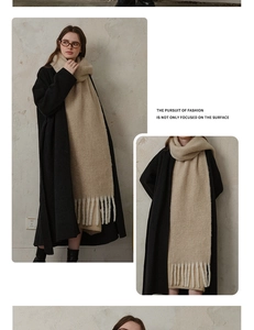 Detail of premium thick wool scarf showing beige knit texture and long tassel fringe