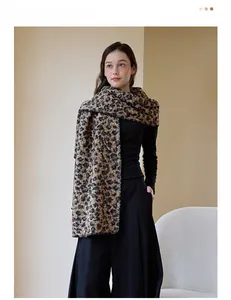 Detailed close-up of leopard print knitted wool scarf with thick texture and refined edges