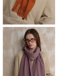 Close-up of fringe texture and wool scarf draping on model for autumn winter