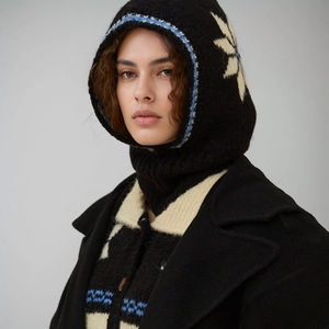 Winter wool balaclava with snowflake pattern and blue trim for warm seasonal headwear