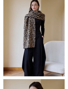 Detail of wool leopard print scarf showing thick texture and stitching on the edges