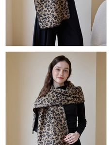 Detail of thick leopard print wool scarf featuring vintage double-sided pattern and stitching