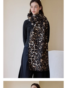 Detail of soft leopard print wool scarf texture with neat edge stitching and plush feel