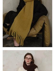 Detail of wool blend scarves in ginger and dark coffee with thick handmade tassels