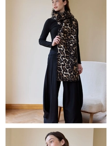 Detailed view of fashionable leopard print wool scarf with thick texture on a model