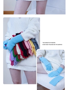 Detail of wool knit gloves in various colors with ribbed cuffs and soft texture finish