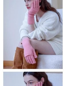 Detailed view of pink wool knitted gloves with ribbed texture and long sleeve design