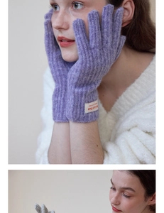 Close-up of knit wool gloves in purple and grey with premium texture and ribbing detail