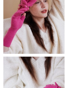 Detail of hot pink wool knit fingerless gloves with ribbed texture and thumb opening