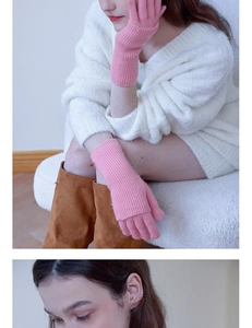 Close-up of the fine ribbed knit texture and soft wool material of pink winter gloves