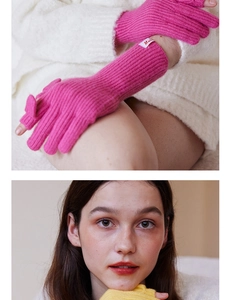 Detail of wool knit fingerless gloves in rose pink and yellow with ribbed texture