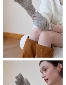 Close-up of gray knitted gloves texture with white brand label and warm wool fabric detail