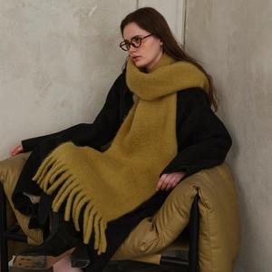 Classic thick wool blend scarf with fringe tassels in warm yellow for winter warmth