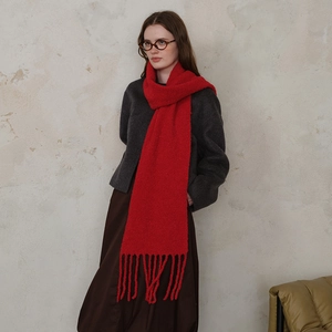 Bright red wool blend knit scarf with long tassels and chunky textured boucle fabric