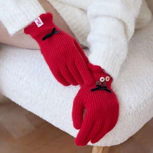 Elegant red wool blend knit gloves with black velvet bows and buttons for winter warmth