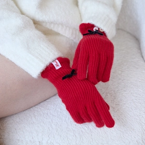 Elegant red wool blend knit gloves for women featuring a black bow and touchscreen tips
