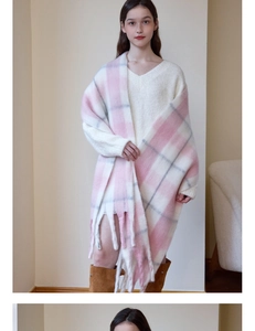 Detail of pink and white checkered cashmere scarf featuring long fringe tassels