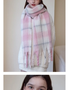 Close-up of pink and white checkered scarf with soft mohair texture and long fringe detail