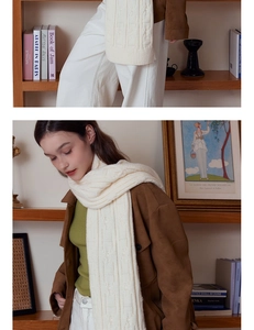 Detail of chunky knit texture and cream white scarf styled with a brown suede jacket