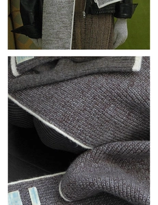 Detail der Wollmischung mit weißer Kontrastpaspelierung am dunkelgrauen Strick-Cardigan