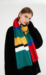 Close-up of fluffy mohair-style knit scarf with bold colorful stripes and chunky texture