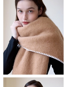 Close-up of thick camel hair scarf featuring refined white whipstitch edge detailing