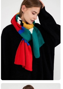 Close-up of multicolor striped knit mohair scarf with vibrant block pattern texture