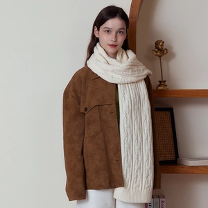 Classic white cable knit wool scarf for winter paired with a stylish brown suede jacket
