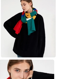 Close-up of thick mohair stripe knit scarf featuring vibrant colorful patchwork texture