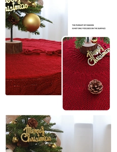 Detail of red cable knit Christmas tree skirt with festive holiday decor ornaments