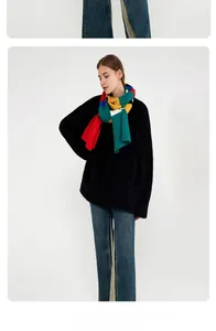 Close-up of thick striped mohair scarf with vibrant red, green, yellow and blue blocks