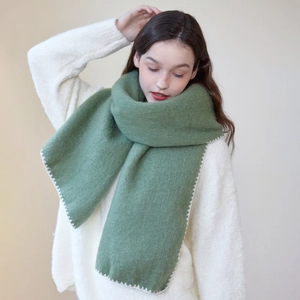 Forest green thick knitted scarf with white contrast stitched edges for winter warmth
