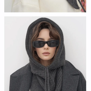 Detailed knit texture of dark grey hooded balaclava scarf with adjustable drawstrings