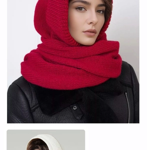 Close-up of red knit balaclava hood scarf worn with a black leather jacket for winter warmth