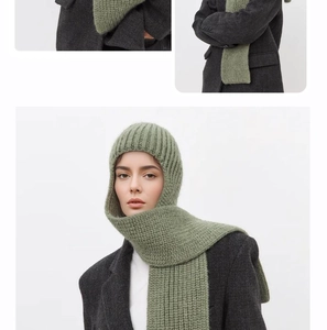 Sage green rib-knit hooded scarf combo showing thick wool blend texture and drape detail