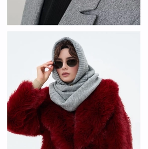 Close-up of thick knit gray balaclava hood showing detailed warm wool texture
