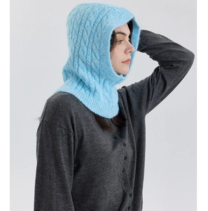 Detail of light blue cable knit texture on wool blend balaclava for women